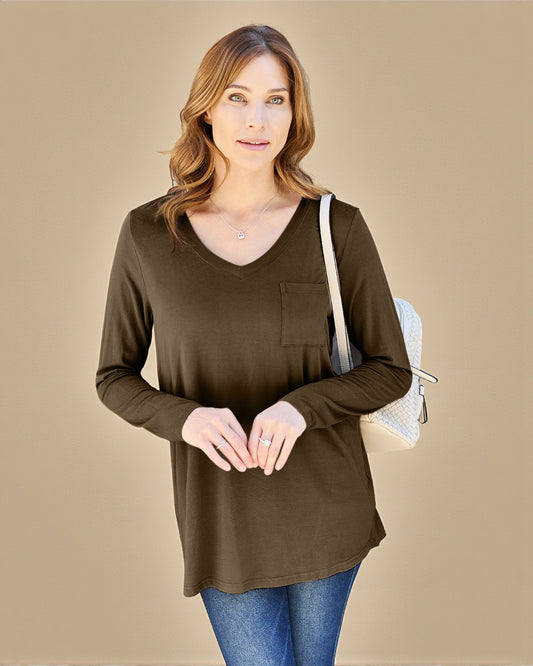 Woman wearing a brown long-sleeve top with a pocket on a beige background