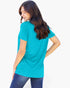 A woman wearing a bright turquoise short-sleeve t-shirt and blue jeans, shown from a three-quarters back view against a plain white background.