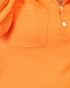Close-up of an orange textured knit polo shirt showing a chest pocket and partial button placket.