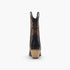 A single black leather cowboy boot shown from the back, featuring tan and brown embroidered detailing on the shaft and a stacked natural wood-look heel, set against a plain white background.