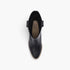 A top-down view of a black leather ankle boot with a side buckle strap, shown on a clean white background. The insole features a tan logo with the brand name 'BEAST'.