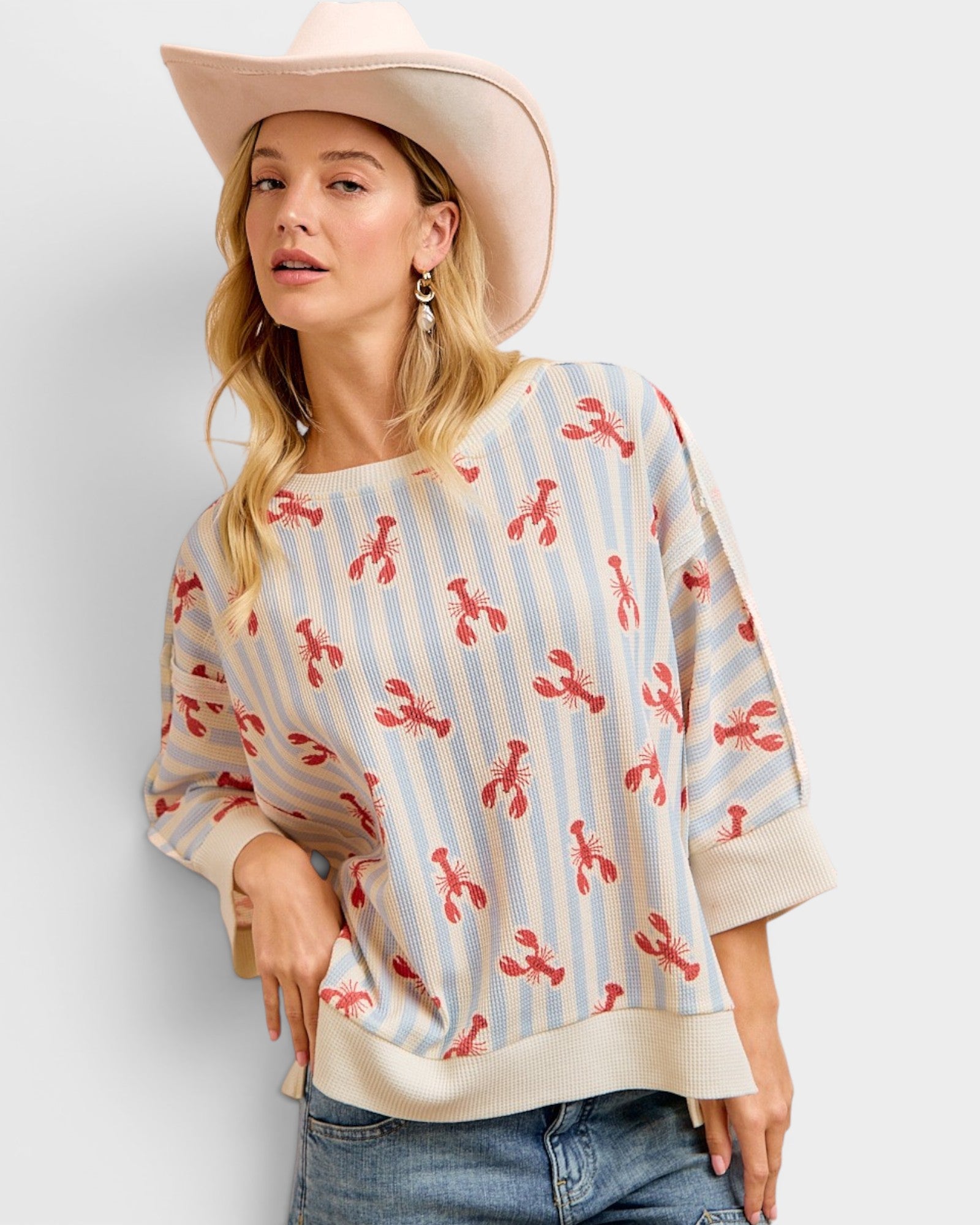 Woman wearing a patterned sweater with a plain background