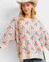 Woman wearing a sweater with lobster pattern and a cowboy hat on a white background