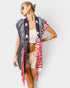 Woman wearing an American flag patterned cardigan on a white background