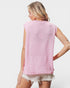 Person wearing a pink sleeveless sweater vest on a white background