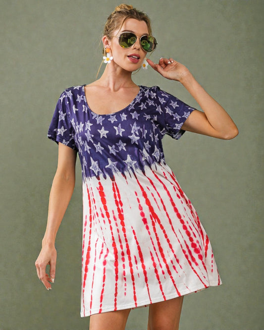 Woman wearing a dress with American flag design on a plain background