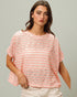 Woman wearing a pink and white striped shirt against a gray background