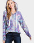 Woman wearing a tie-dye hoodie with a plain background
