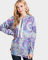 Woman wearing a tie-dye hoodie with a white background