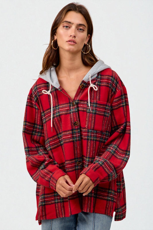 Woman wearing a red plaid hoodie with a gray hood against a white background