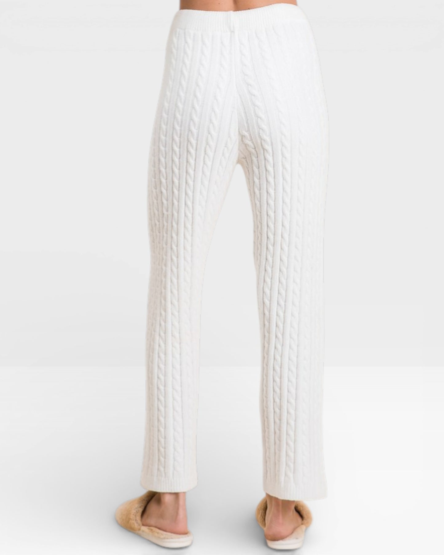 White ribbed knit pants on a white background