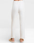White ribbed knit pants on a white background