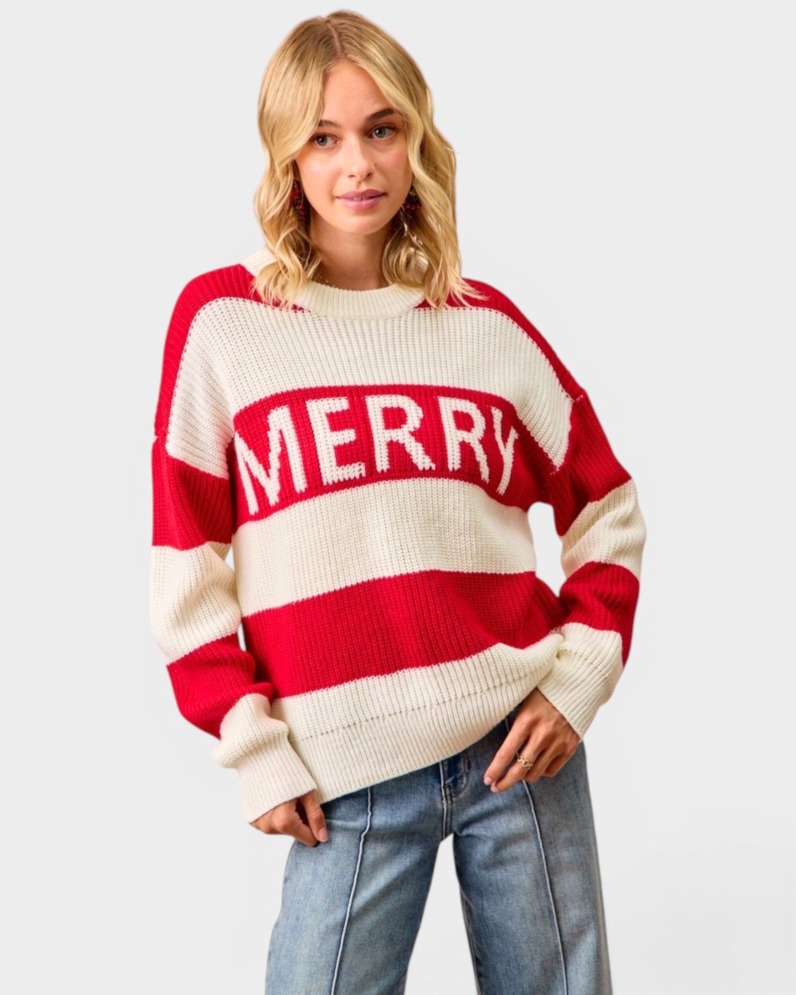 Person wearing a red and white striped sweater with 'MERRY' text on a plain background