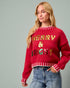 Woman wearing a red sweater with 'Merry & Bright' text on a gray background