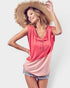 Woman wearing a pink sleeveless top and straw hat on a white background