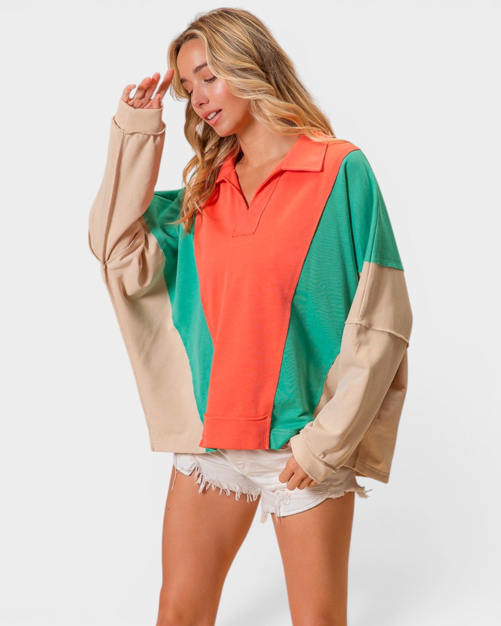 Woman wearing a colorful shirt with a white background
