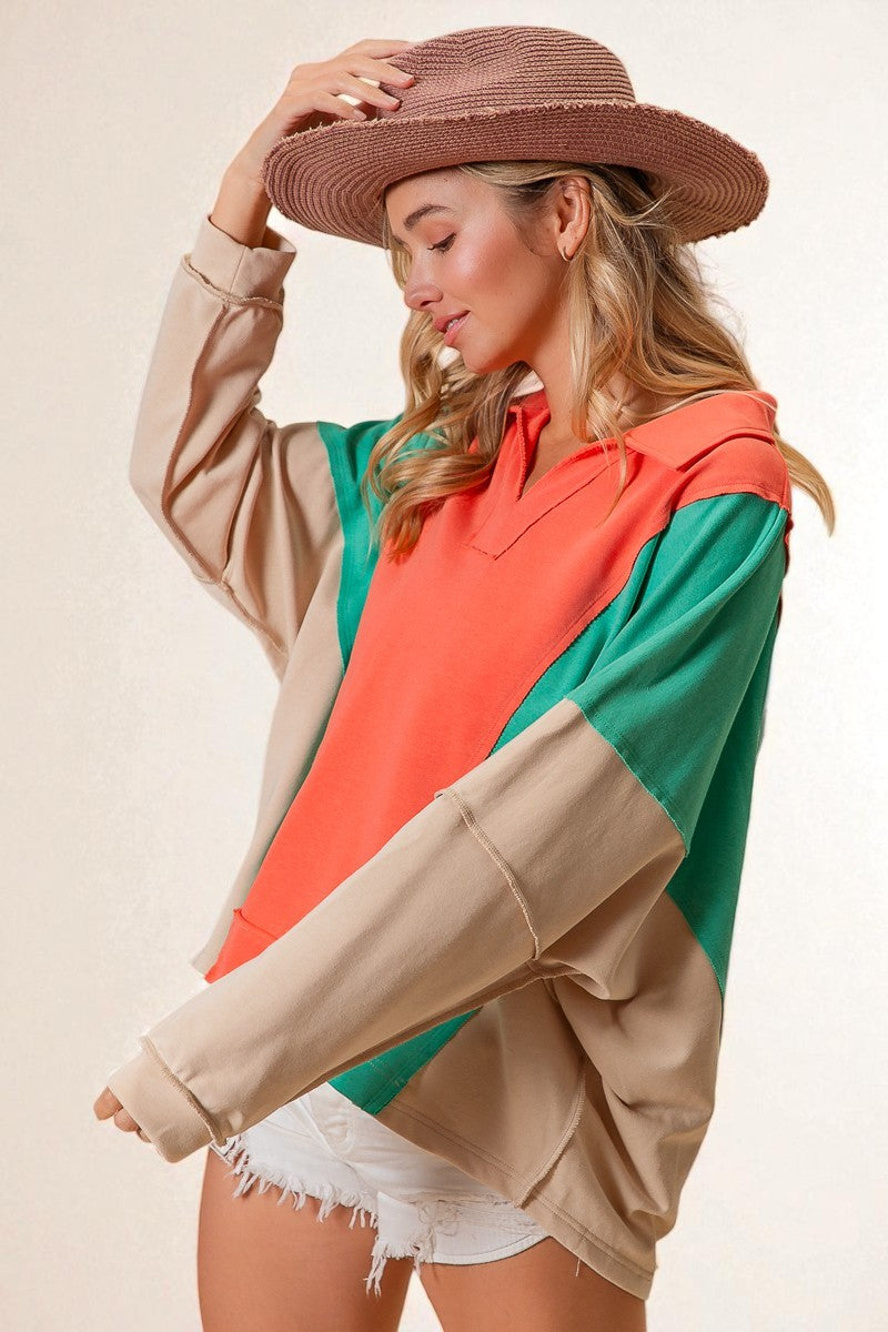 Woman wearing a colorful outfit with a straw hat on a beige background