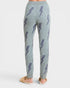 Light blue knitted pants with lightning bolt pattern on a white background