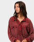 Woman wearing a red top on a white background
