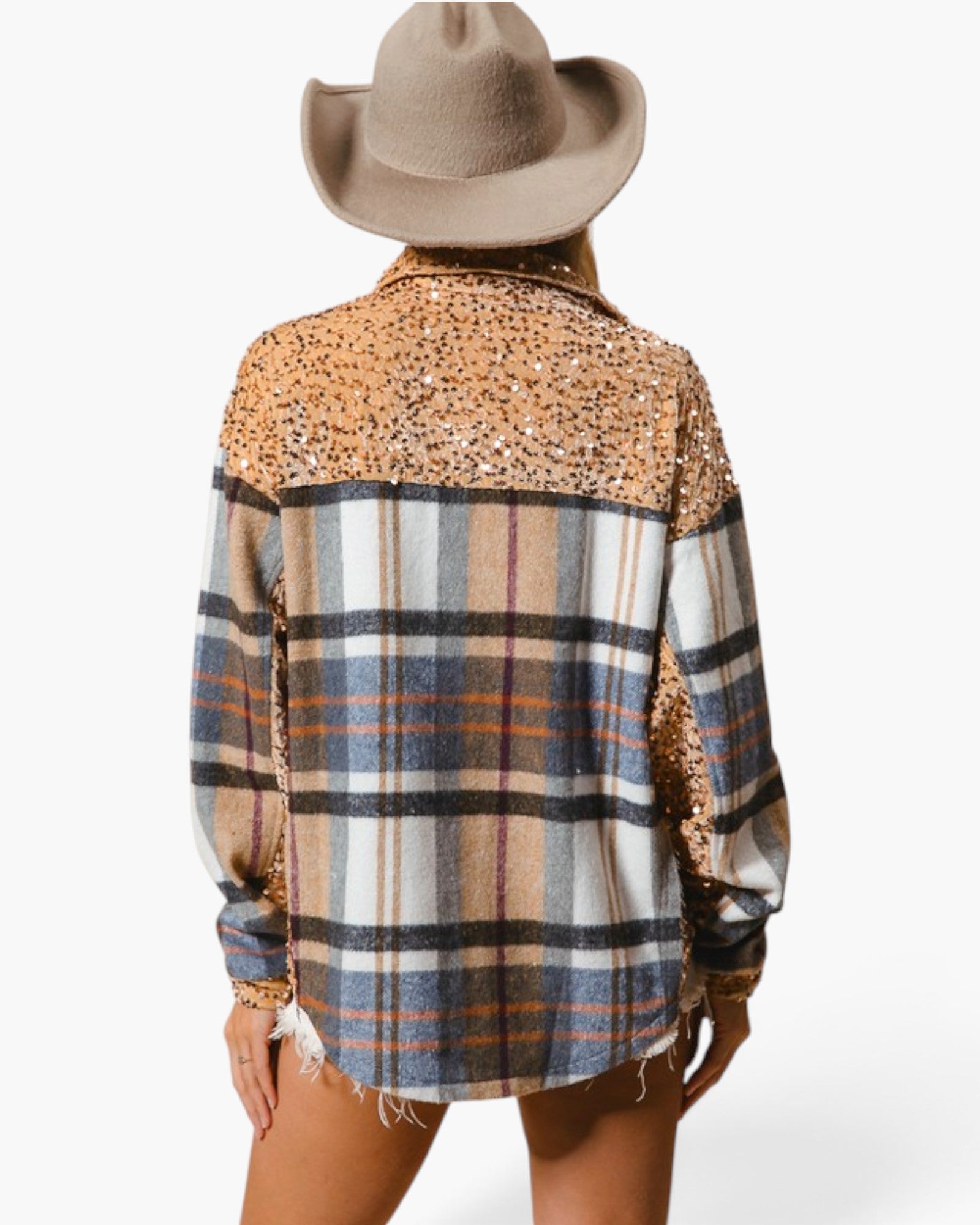 A woman shown from the back wearing a long-sleeve plaid shirt with leopard-print sequin detailing across the shoulders and a tan cowboy hat against a plain white background.