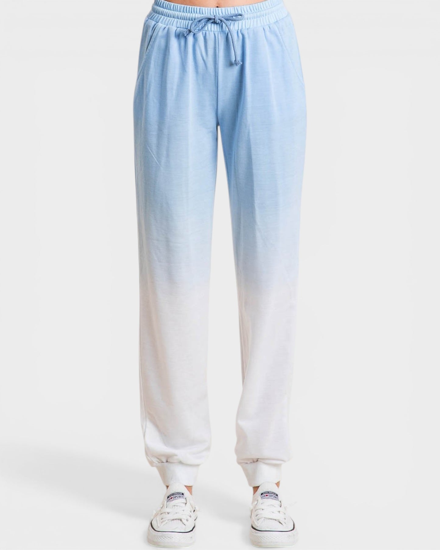 Light blue to white gradient pants on a white background