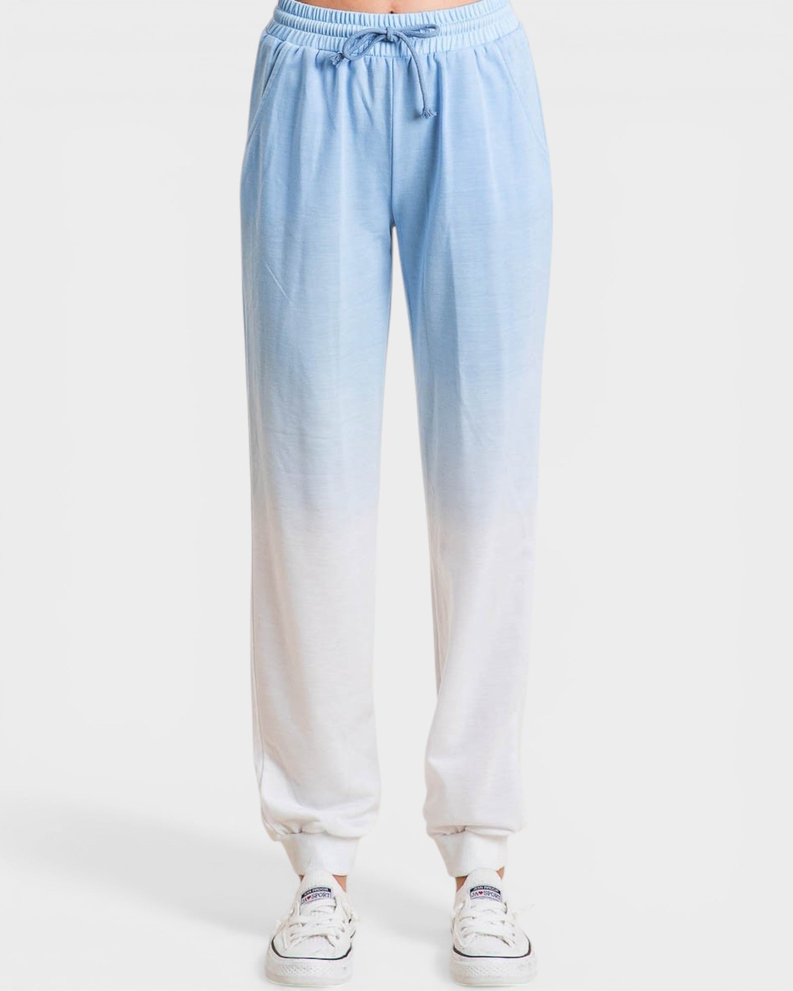 Light blue to white gradient pants on a white background