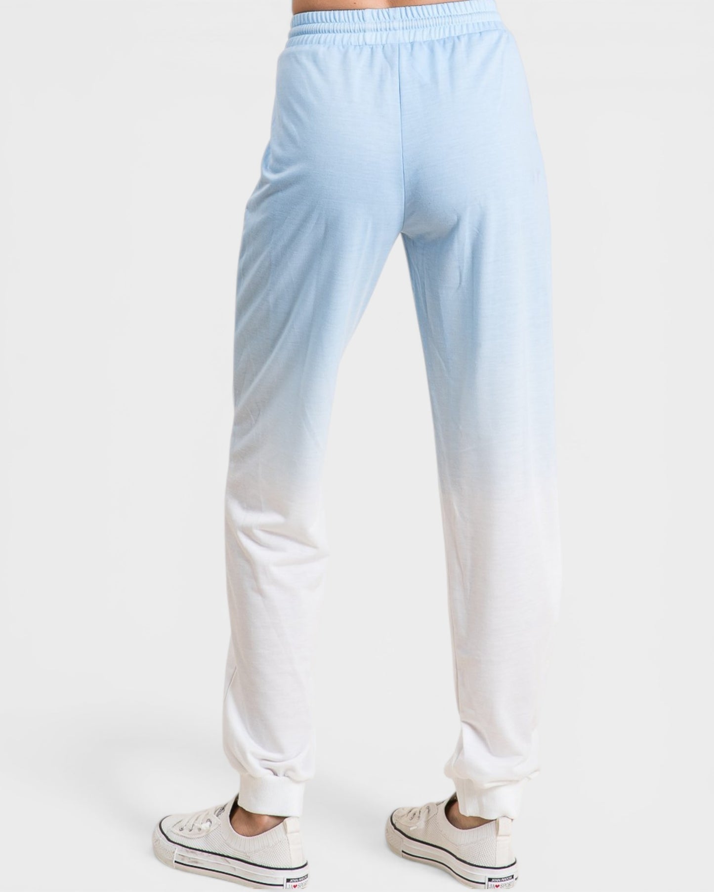 Light blue and white gradient pants on a white background