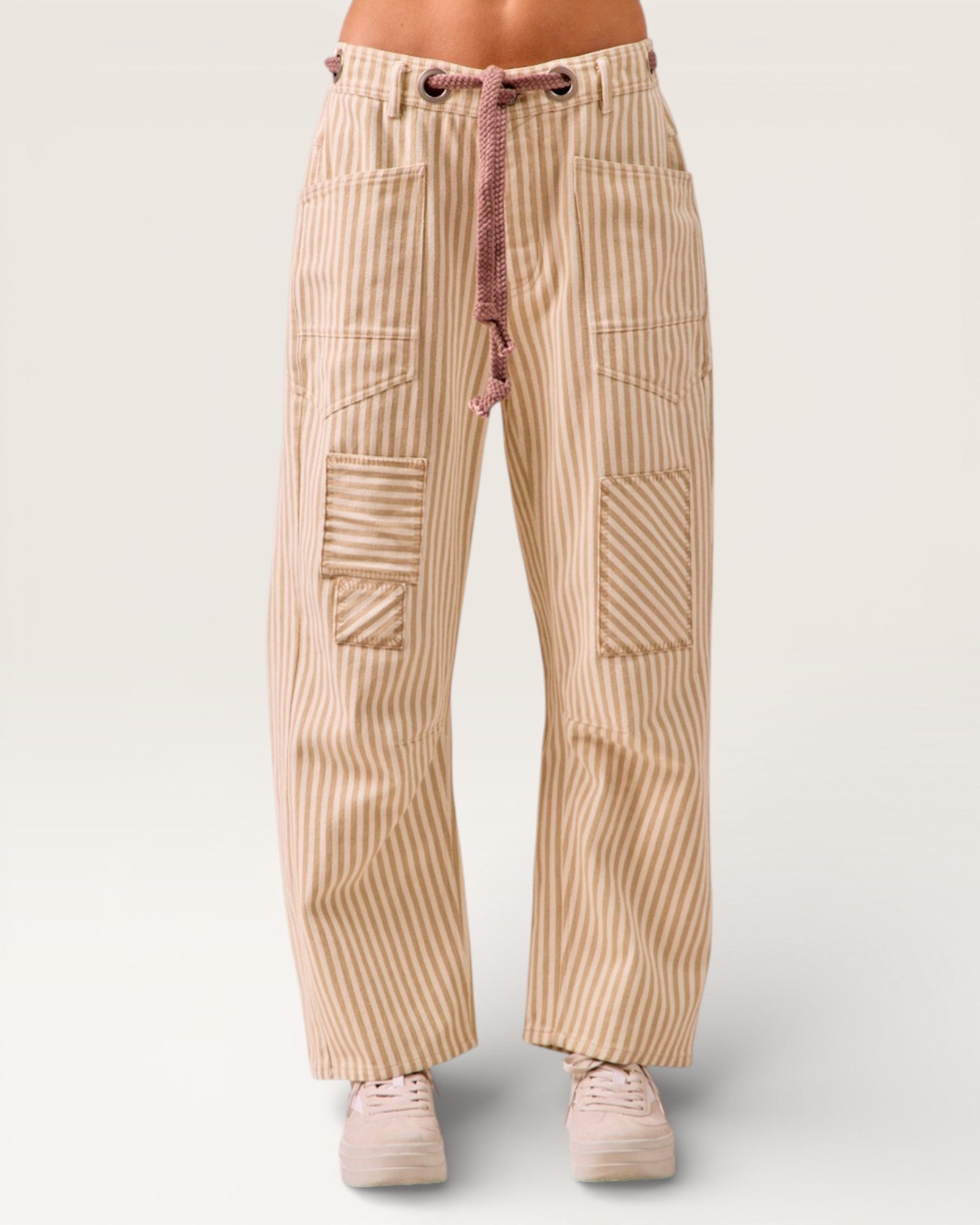 Beige striped pants with a drawstring on a white background