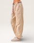 Beige striped pants worn by a person on a white background