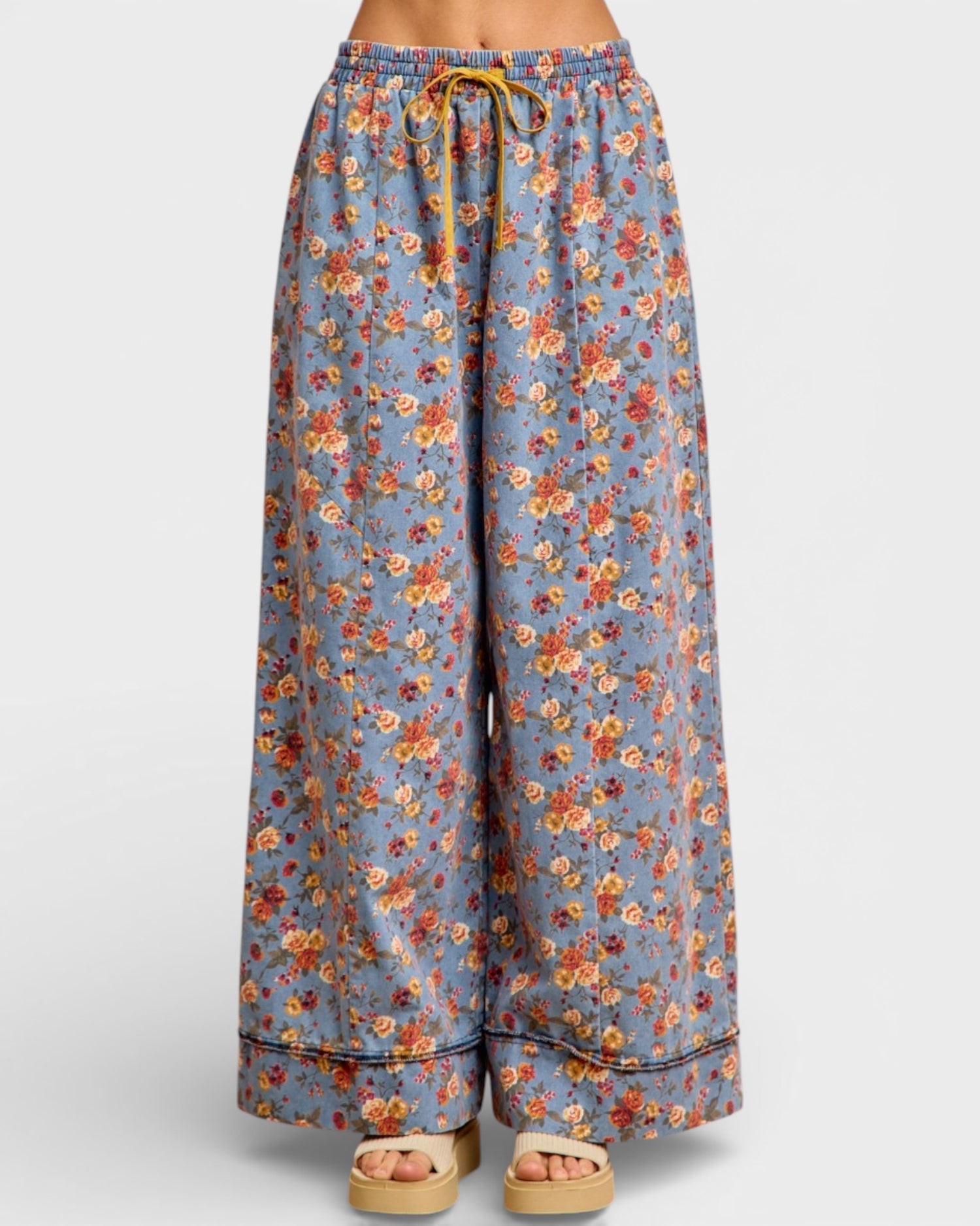 Floral patterned pants on a white background