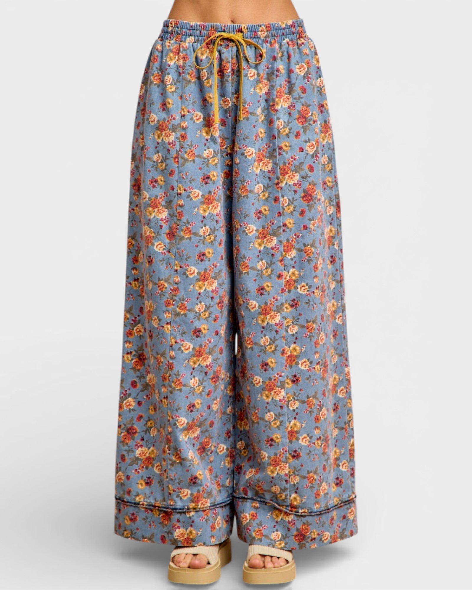 Floral patterned pants on a white background