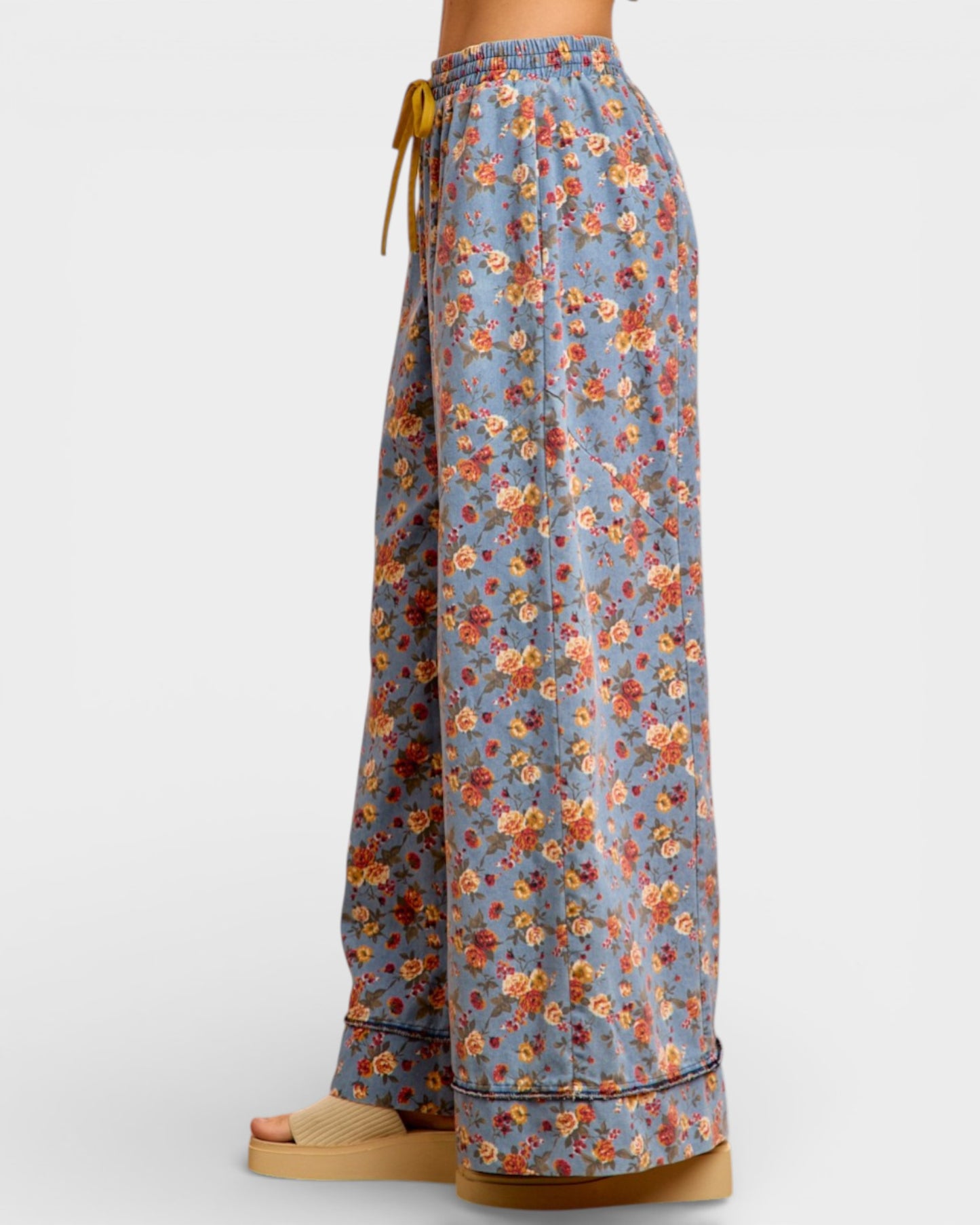 Floral-patterned pants on a white background