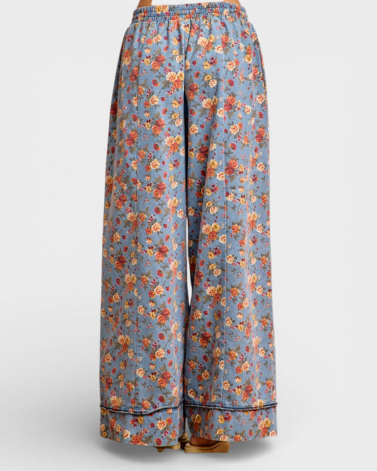 Floral-patterned pants on a light gray background