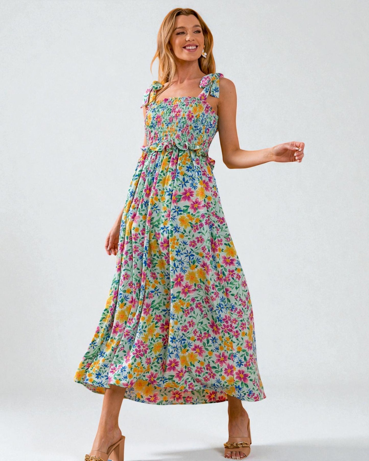 Woman wearing a floral dress on a white background