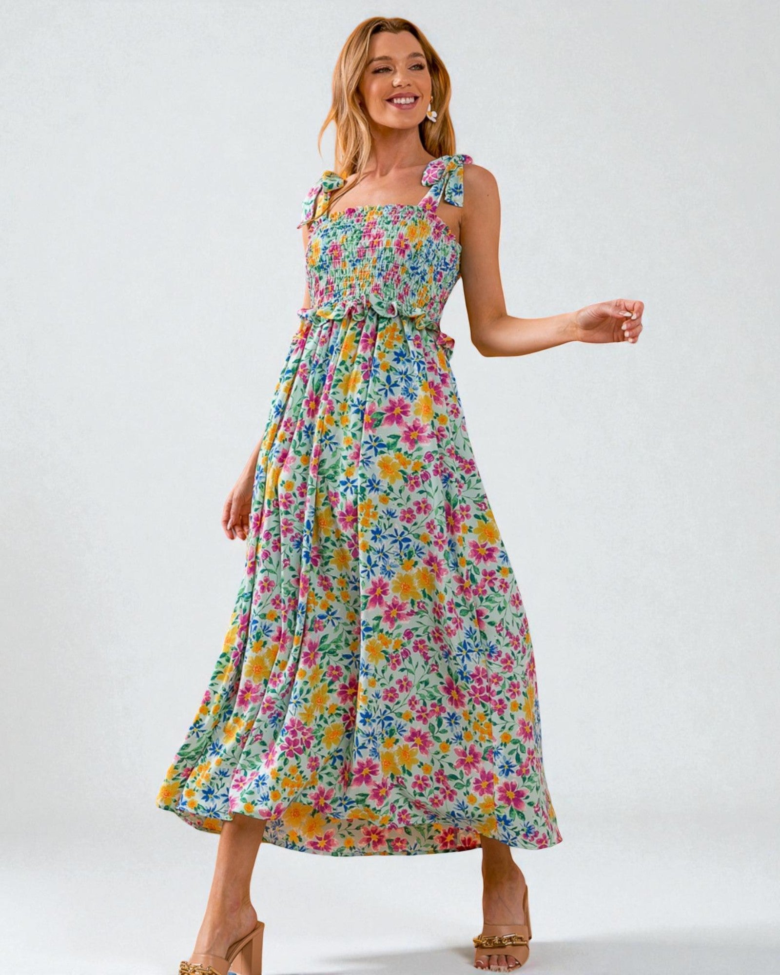 Woman wearing a floral dress on a white background