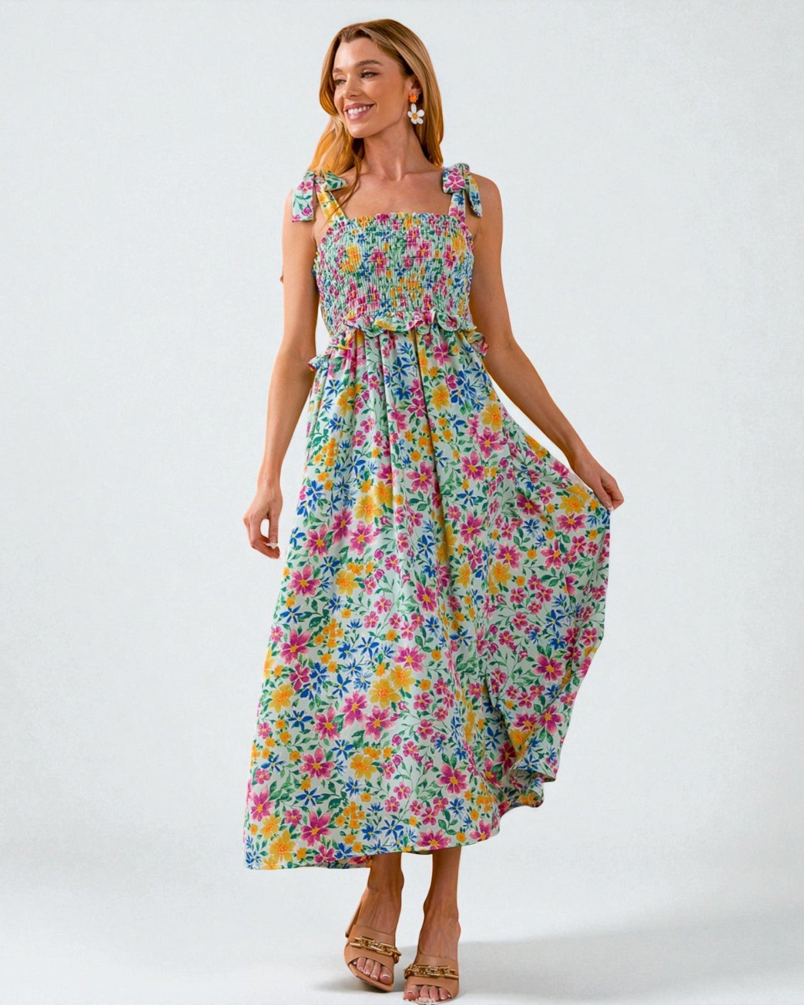 Woman wearing a floral dress on a white background