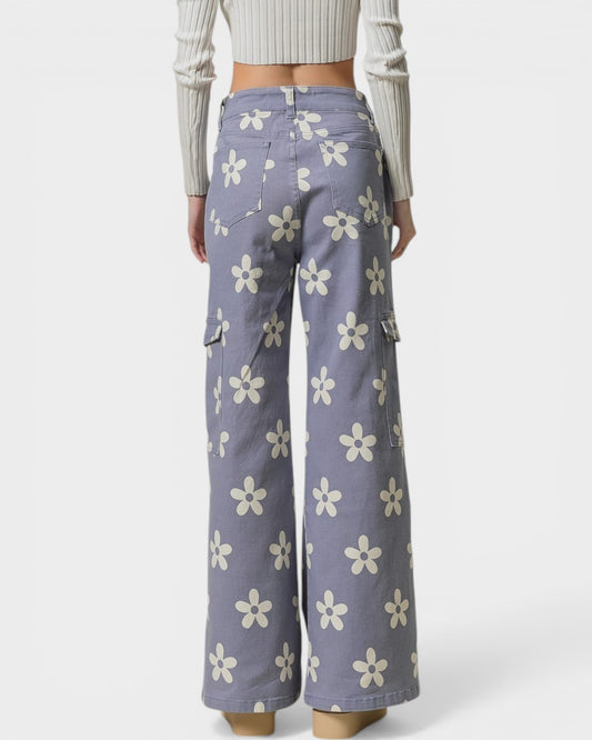 Purple floral-patterned pants worn by a person on a white background