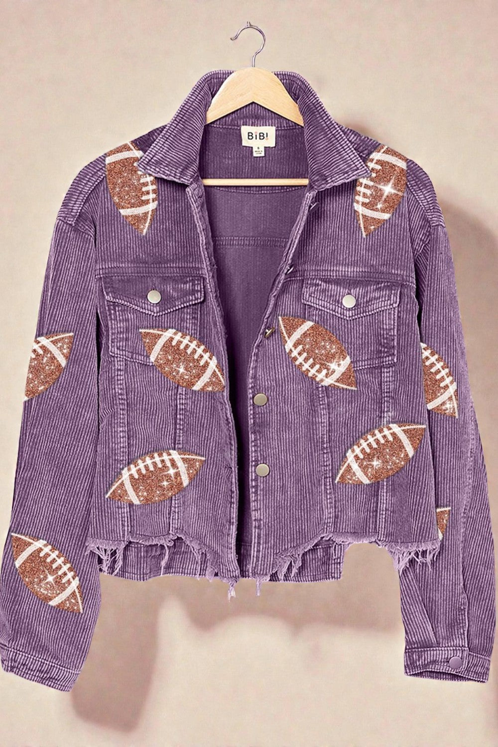 Purple denim jacket with football patterns on a beige background