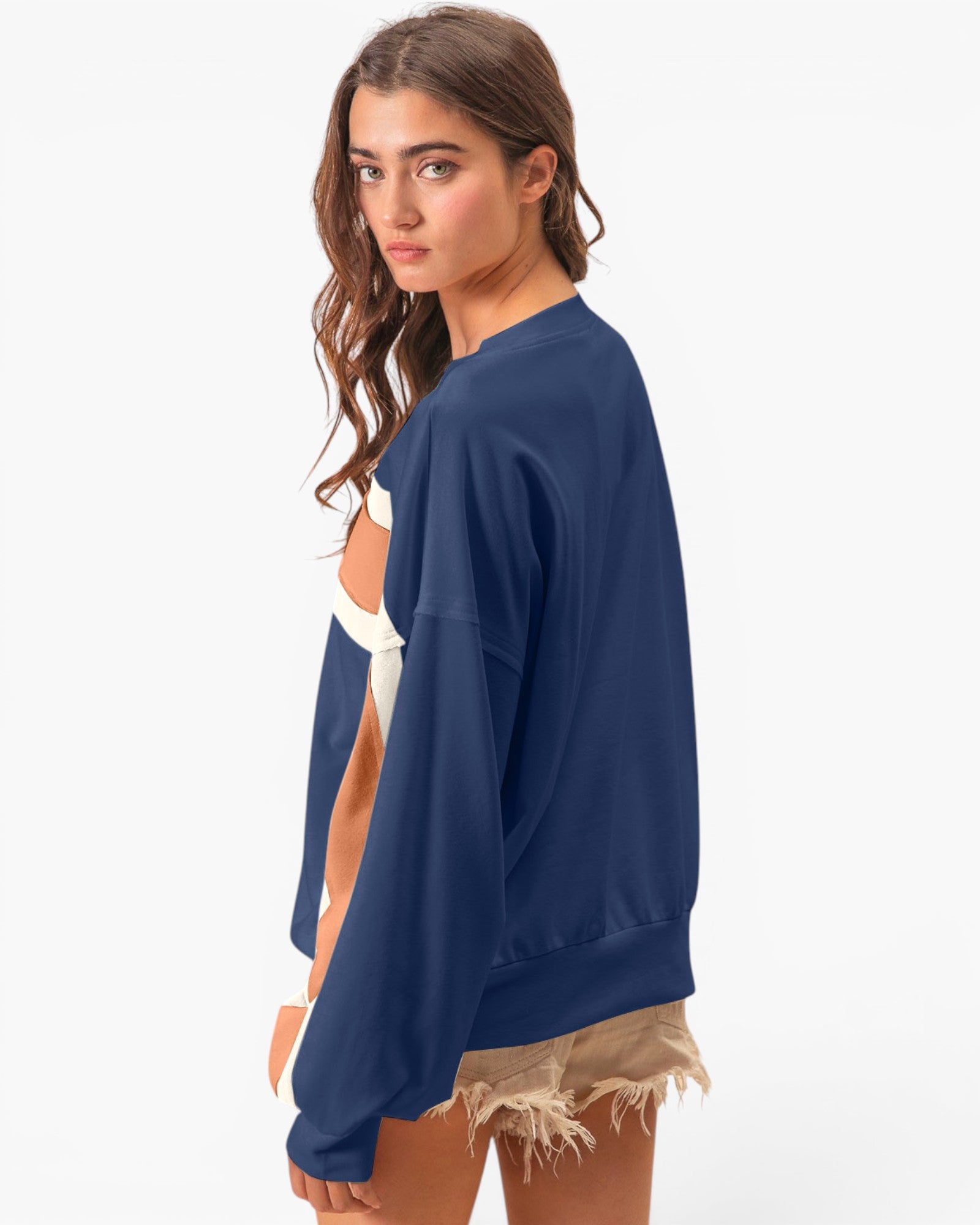 A woman modeling a navy blue crewneck sweatshirt, shown from a side-back angle against a clean white studio background.