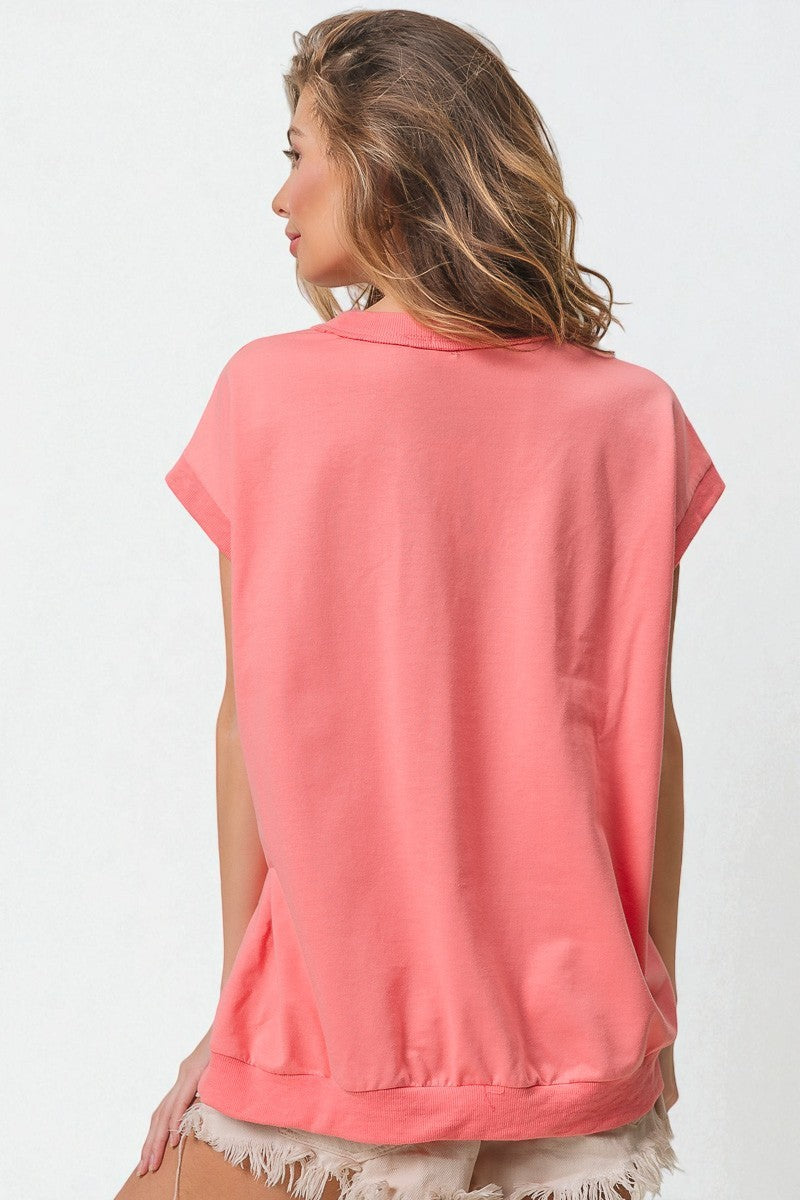 Woman wearing a pink sleeveless top on a white background