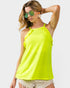 Woman wearing a bright yellow tank top and sunglasses on a white background