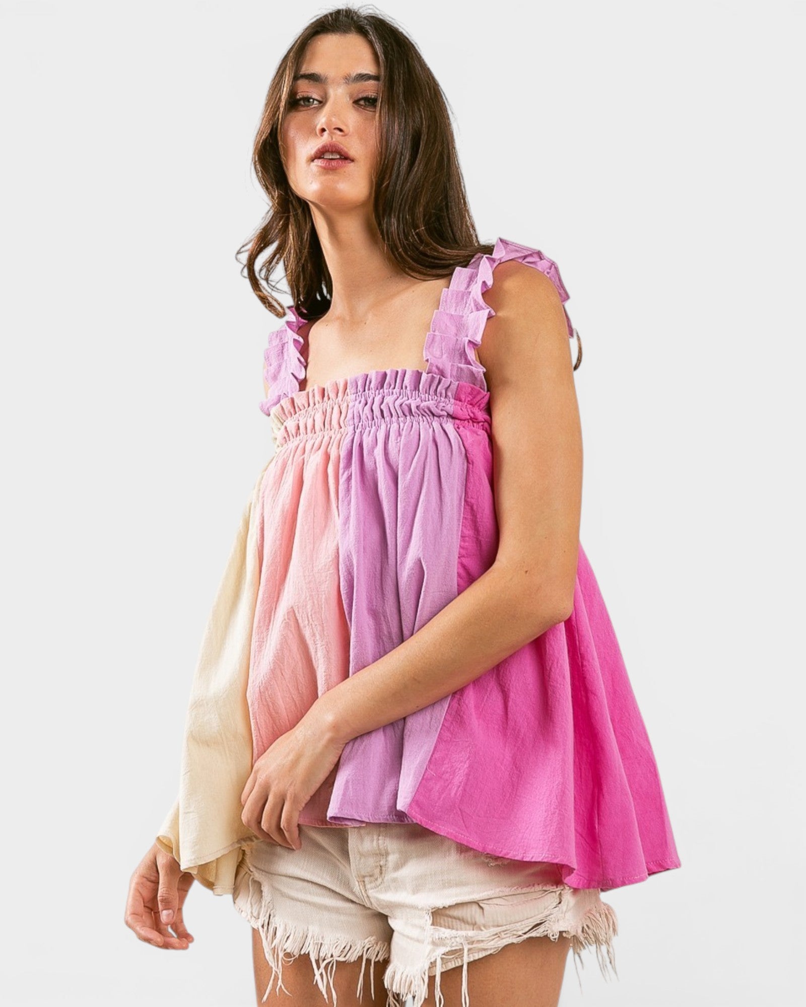 Woman wearing a pink top with a white background