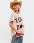 Woman wearing a beige t-shirt with 'Touchdown' text, holding a football, and wearing a cowboy hat on a white background