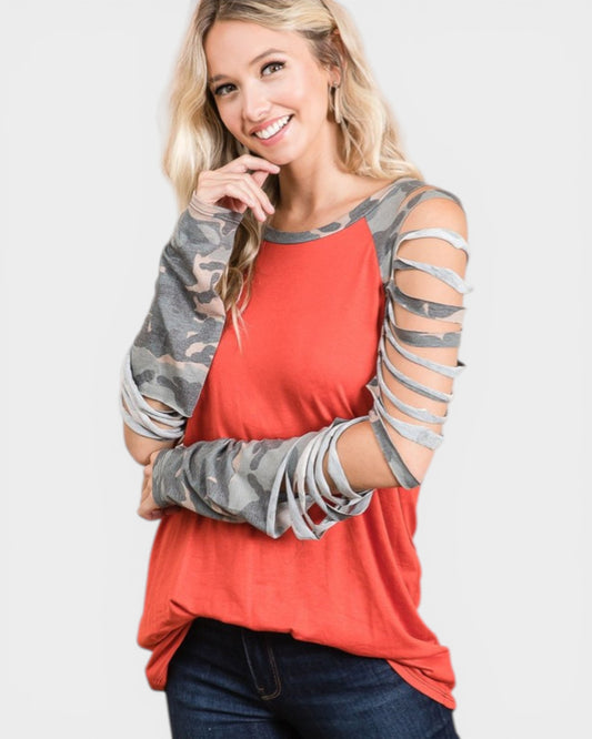 Woman wearing a red shirt with camouflage sleeves on a white background