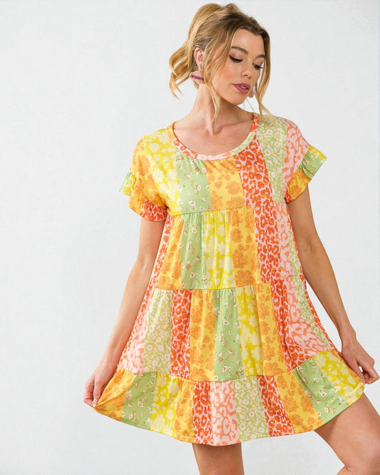 Woman wearing a colorful patchwork dress on a white background