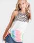 Woman wearing a leopard print top with a tie-dye skirt on a white background