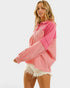Woman wearing a pink and coral color-blocked hoodie on a white background