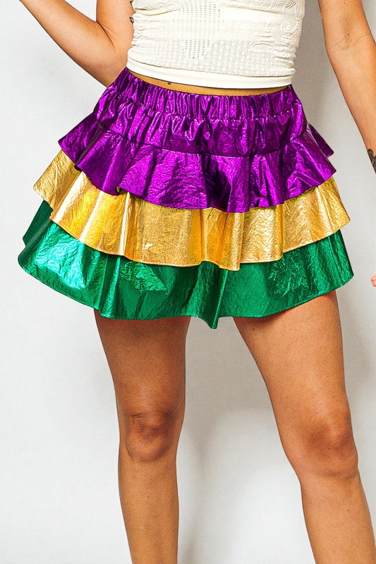 Multicolored ruffled skirt worn by a person on a white background