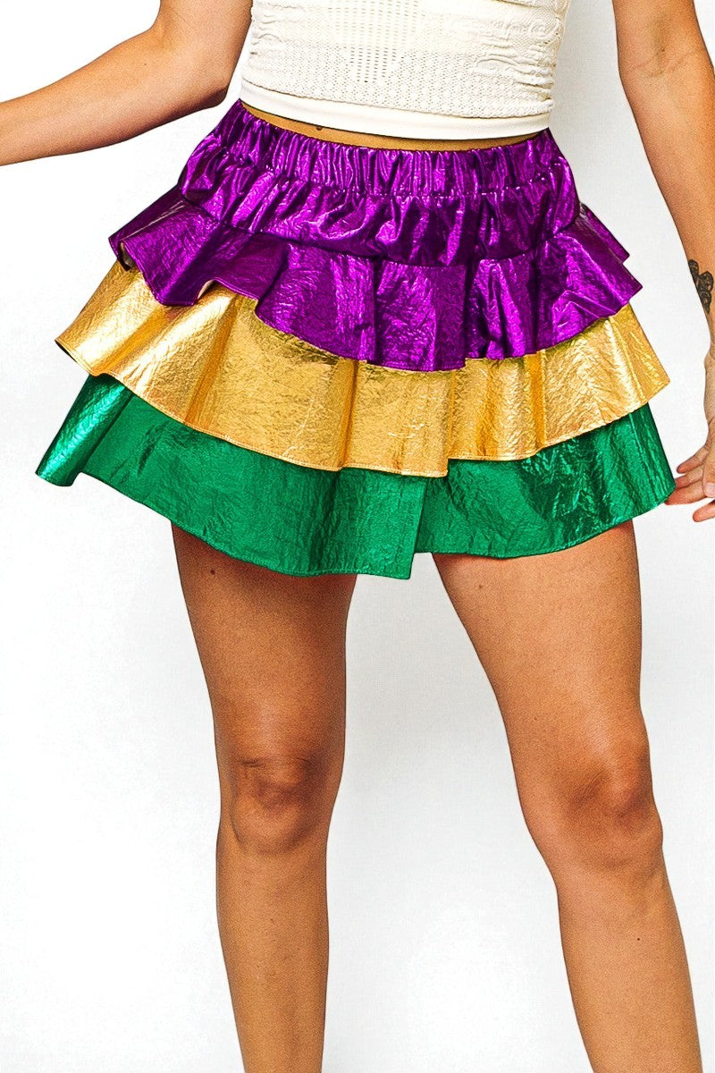 Multicolored ruffled skirt worn by a person on a white background