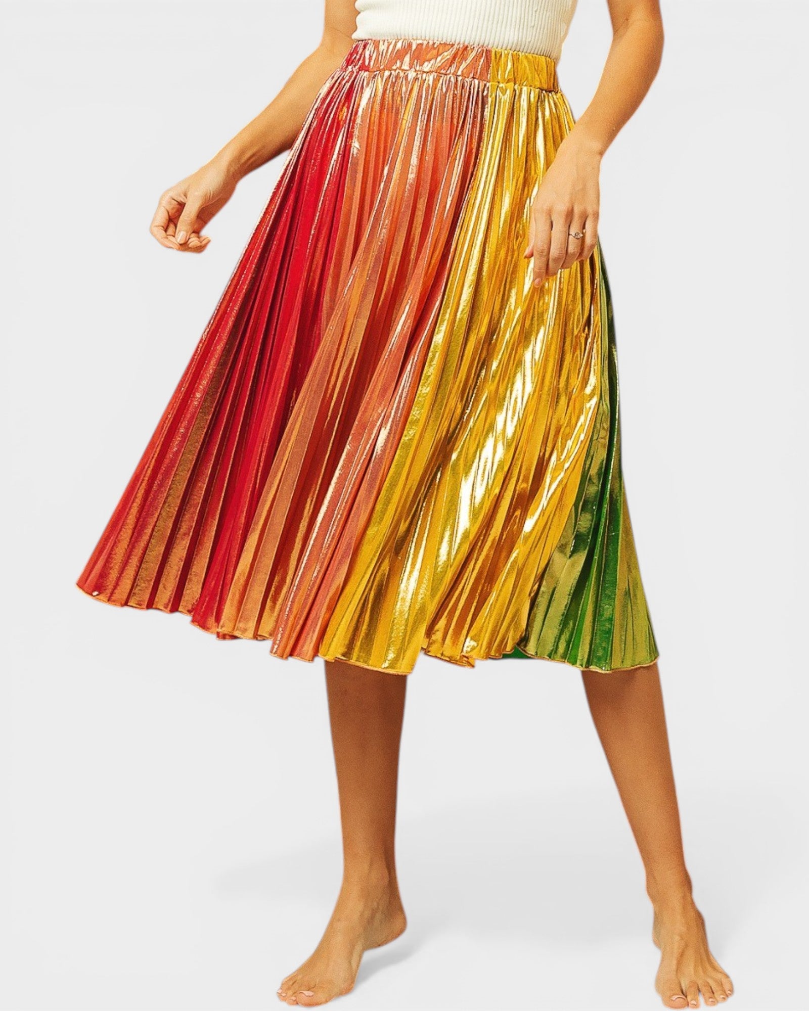 Multicolored pleated skirt worn by a person on a white background